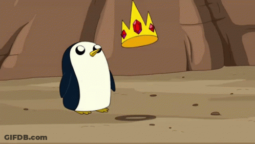 A Penguin Is Standing Next To A Crown With Ruby Stones On It GIF