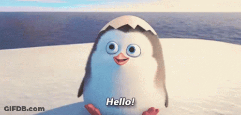 A Penguin Is Standing On Top Of A Snow Covered Surface And Waving . GIF