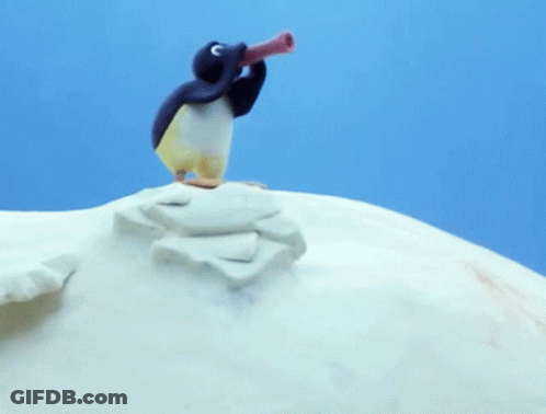 A Penguin Is Standing On Top Of A Snowy Hill And Looking Through A Telescope GIF