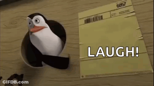 Penguin Laughing Out Of Hole In Paper GIF