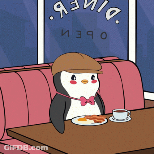 A Penguin Sits At A Table With A Plate Of Food In Front Of A Diner Window GIF