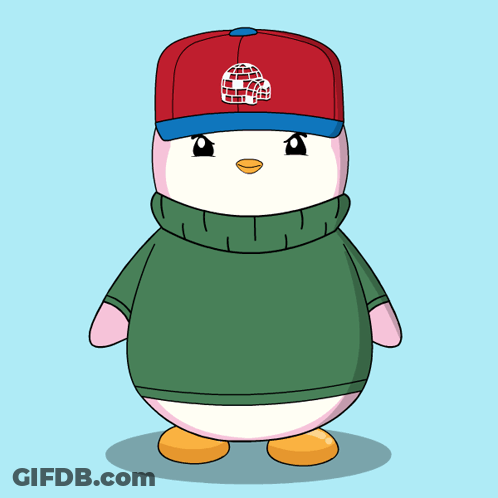 A Penguin Wearing A Green Sweater And A Red Hat With An Igloo On It GIF