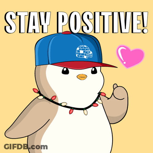 A Penguin Wearing A Hat And Christmas Lights Is Giving A Thumbs Up And Says Stay Positive GIF