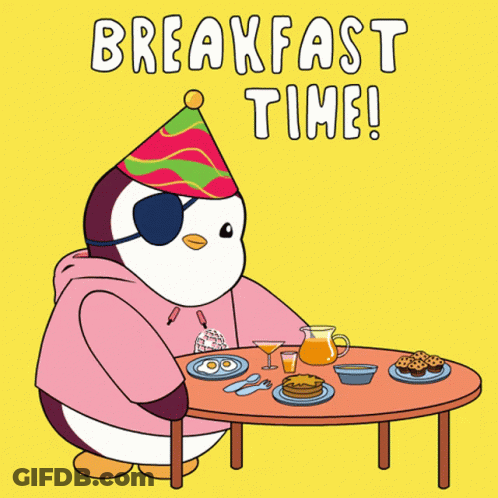 A Penguin Wearing A Party Hat Is Sitting At A Table With Food And The Words Breakfast Time GIF