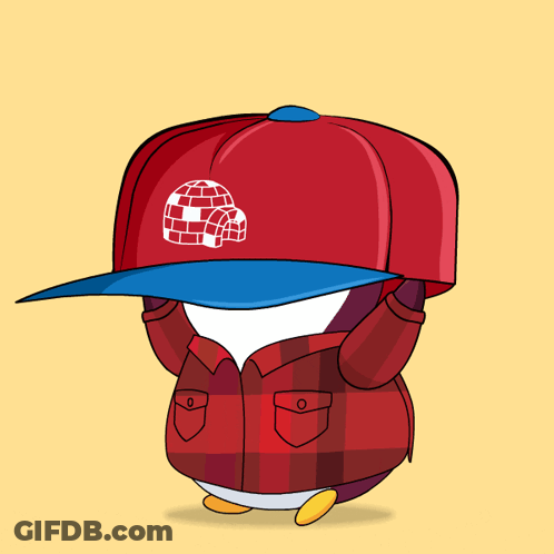 A Penguin Wearing A Plaid Jacket And A Red Hat GIF