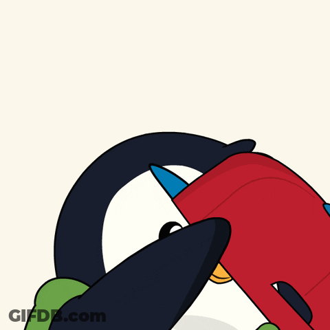 A Penguin Wearing A Red Hat And A Green Jacket Is Covering His Nose GIF