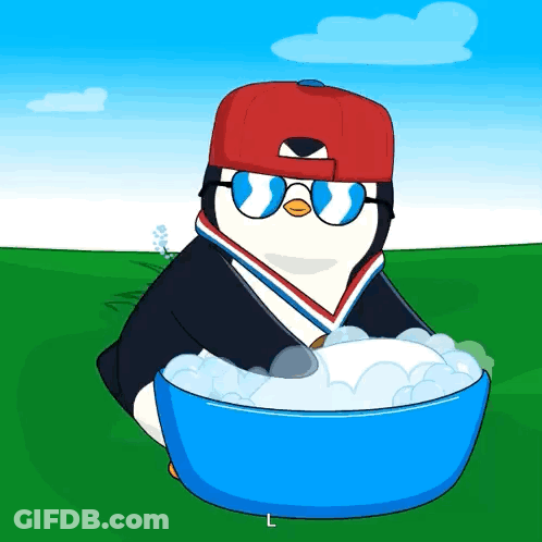 A Penguin Wearing A Red Hat And Sunglasses Is Holding A Blue Bowl Of Foam GIF