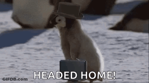 A Penguin Wearing A Top Hat And Carrying A Briefcase Is Standing In The Snow . GIF