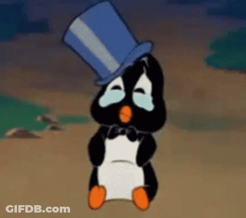 A Penguin Wearing A Top Hat Is Crying . GIF