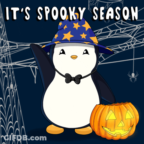 A Penguin Wearing A Witch Hat And Bow Tie Holds A Pumpkin With The Words It 'S Spooky Season Above It GIF