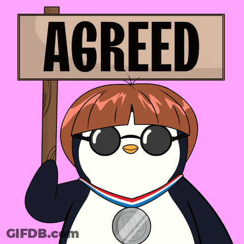 A Penguin Wearing Sunglasses Holds A Sign That Says Agreed GIF