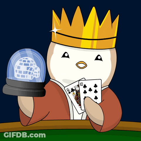 A Penguin With A Crown Is Holding A Pair Of Playing Cards And A Snow Globe GIF
