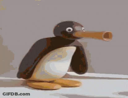 A Penguin With A Large Beak Is Sitting On A White Surface GIF