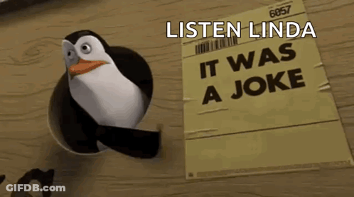 A Penguin With A Sign That Says Listen Linda It Was A Joke GIF