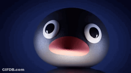 A Penguin With Big Eyes And A Red Beak GIF