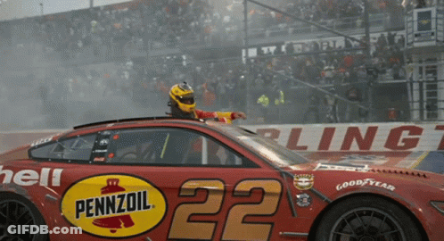 A Pennzoil Race Car With The Number 22 GIF