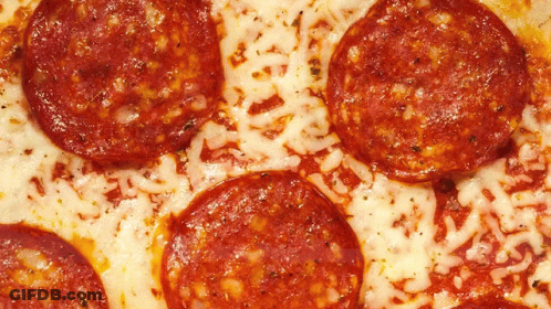 A Pepperoni Pizza With A Lot Of Cheese On It GIF