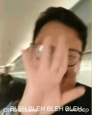 A Person Covering Their Face With Their Hand And The Words Bleh Bleh Bleh Video Below Them GIF