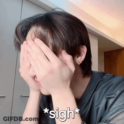 A Person Covering Their Face With Their Hands And The Word Sigh Written Below Them GIF