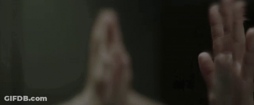 A Person Covering Their Face With Their Hands GIF