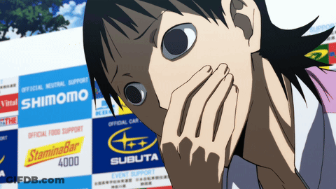 A Person Covering Their Mouth In Front Of A Sign That Says Shimomo GIF
