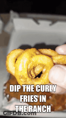 A Person Dipping Curly Fries In Ranch Sauce GIF