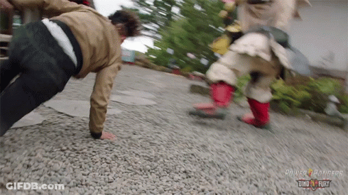 A Person Doing Push Ups With The Word Power Rangers On The Bottom GIF