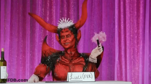 A Person Dressed As A Devil With A Sign That Says Lucifer On It GIF
