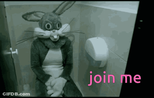 A Person Dressed In A Bunny Costume Is Sitting On A Toilet GIF