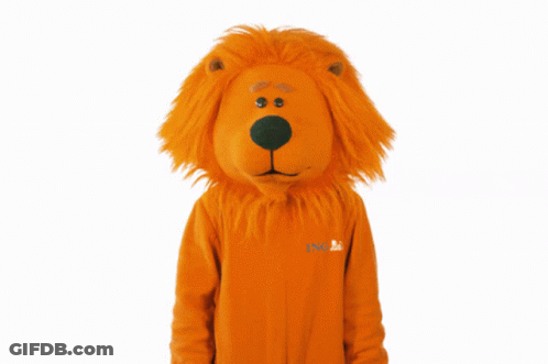 A Person Dressed In An Orange Lion Costume With A Nl Logo On The Front GIF