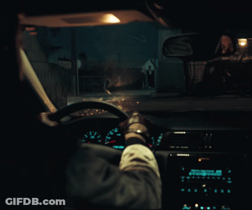 A Person Driving A Car At Night With A Sign That Says ' A ' On The Side GIF