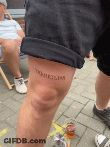 A Person Has A Tattoo On Their Knee That Says Frankistan GIF