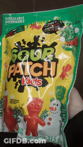 A Person Holding A Bag Of Sour Patch Kids GIF