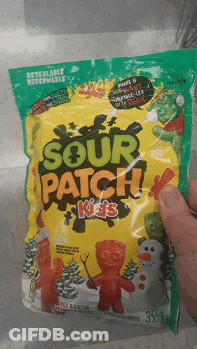 A Person Holding A Bag Of Sour Patch Kids GIF