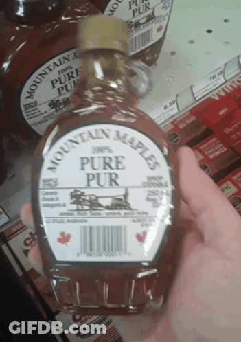 A Person Holding A Bottle Of Mountain Maple Pure Pur GIF