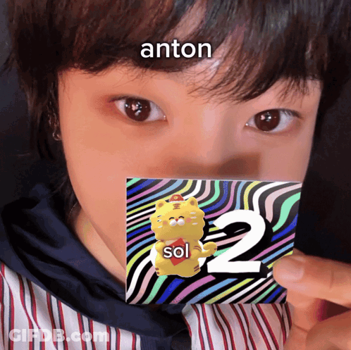 Person Holding Card With 2 And Anton GIF