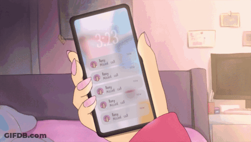 A Person Holding A Cell Phone With The Time Of 3:23 On It GIF