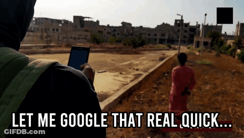 A Person Holding A Cell Phone With The Words " Let Me Google That Real Quick " Below Them GIF