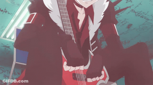 A Person Holding A Guitar In Front Of A Wall With Graffiti On It That Says " The Power " GIF