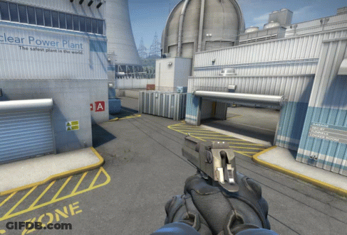 A Person Holding A Gun In Front Of A Nuclear Power Plant GIF