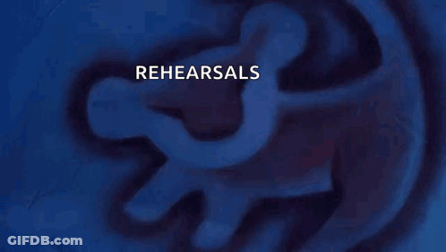 A Person Holding A Gun With Rehearsals Written On It GIF