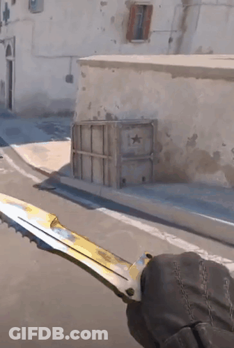 A Person Holding A Knife In Front Of A Building With A Star On It GIF