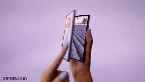 A Person Holding A Phone With A Field On The Screen GIF