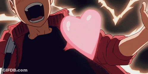 A Person Holding A Pink Heart In Their Hand GIF
