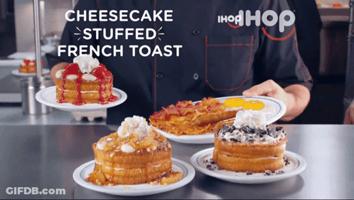 A Person Holding A Plate Of Cheesecake Stuffed French Toast On A Counter GIF