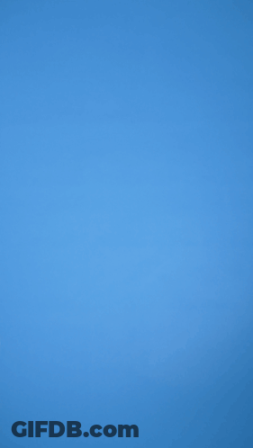 A Person Holding A Red Balloon Against A Blue Sky GIF