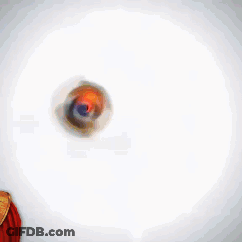 A Person Holding A Red Card In Front Of Another Person 'S Face GIF
