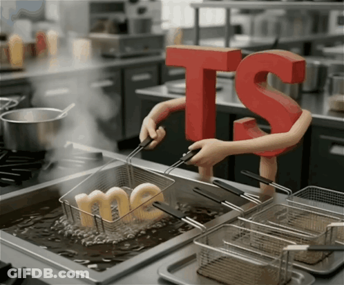 A Person Holding A Red Letter Ts Over A Fryer GIF