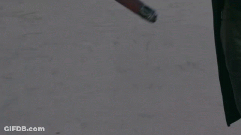A Person Holding A Red Light Saber With A Pink Background GIF