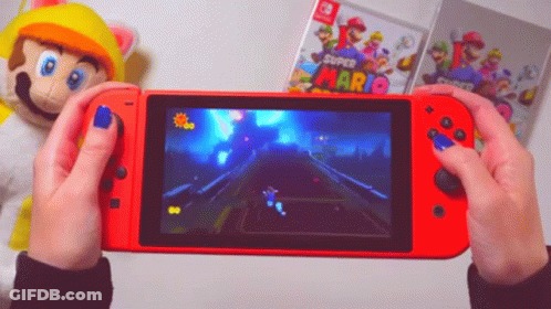 A Person Holding A Red Nintendo Switch With A Super Mario Game On The Screen GIF